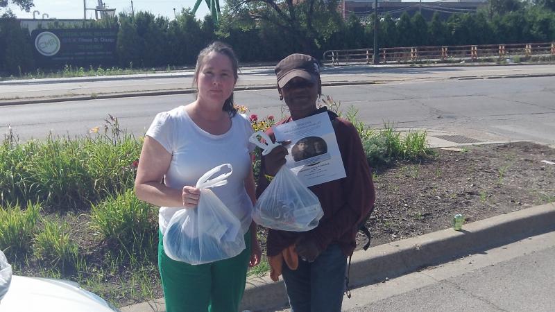 Jeanne Coatar GCA volunteer (left) seen working with a homeless woman in Chicago
